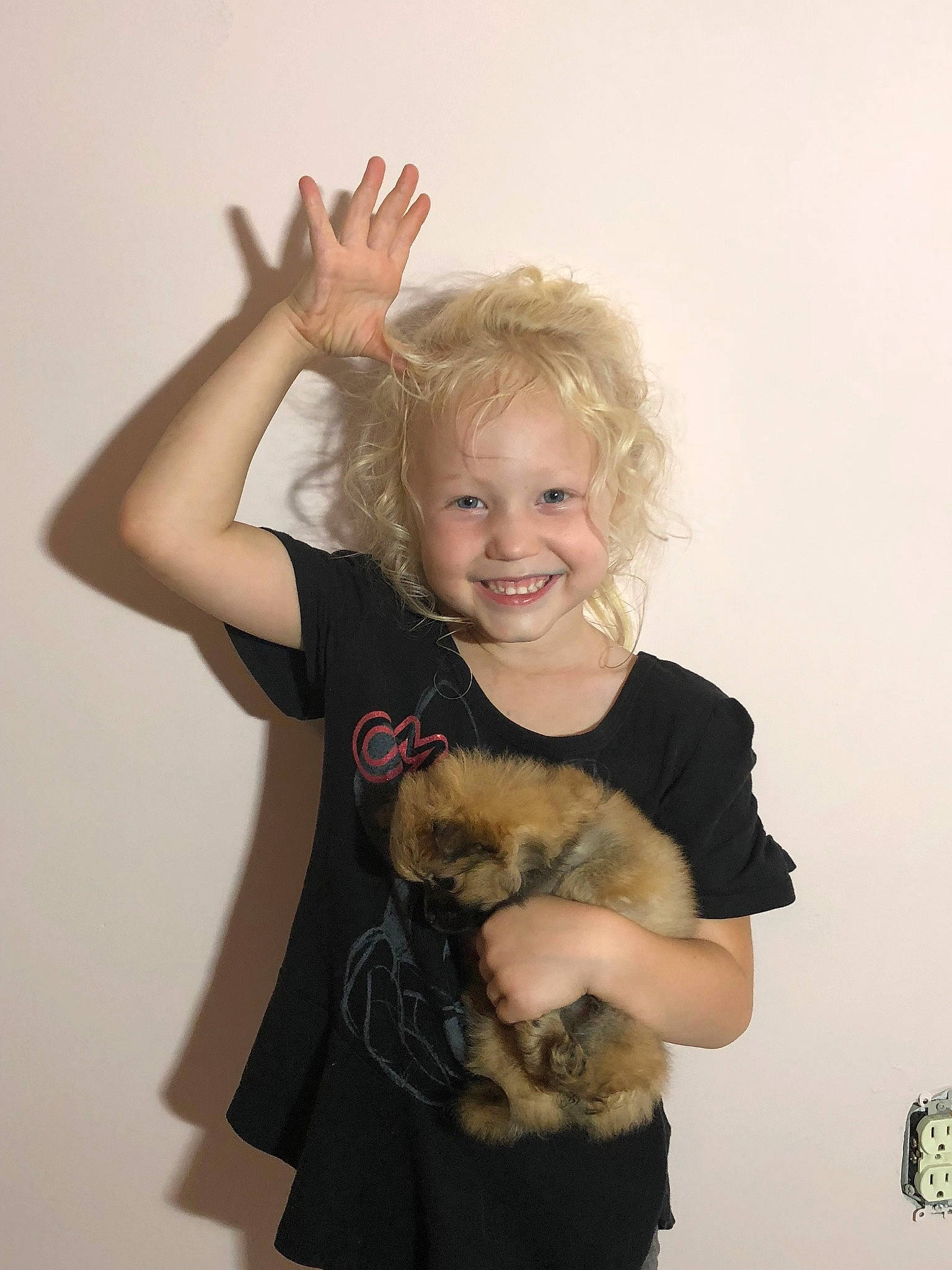 Frankie is registered to the contest to win money with this photo: abdomen, arm, blond, canidae, carnivore, cat, fawn, felidae, ferret, finger, fur, gesture, joint, joy, long_hair, person, shoulder, smile, t_shirt