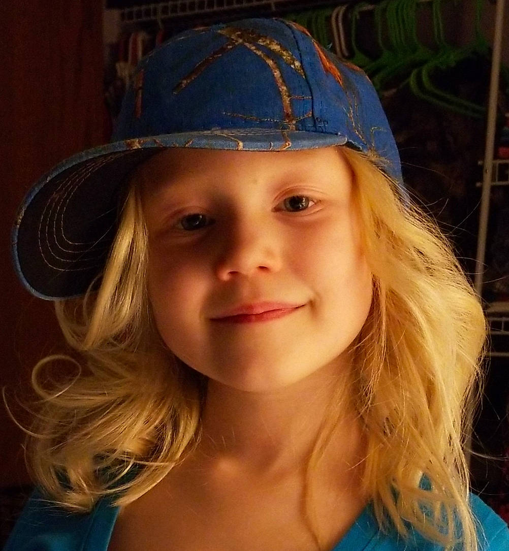 Frankie is registered to the contest to win money with this photo: beauty, blond, brown_hair, cap, child_model, chin, clothing, costume_hat, face, fashion_accessory, feathered_hair, hair, hat, headgear, lip, long_hair, person, smile, sun_hat
