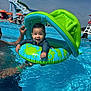 baby, child, pool, water, inflatable, float, smile, happy, summer, outdoor, swimming, water_slide, canopy, people, swimwear, sunny, fun, recreation, parent, support