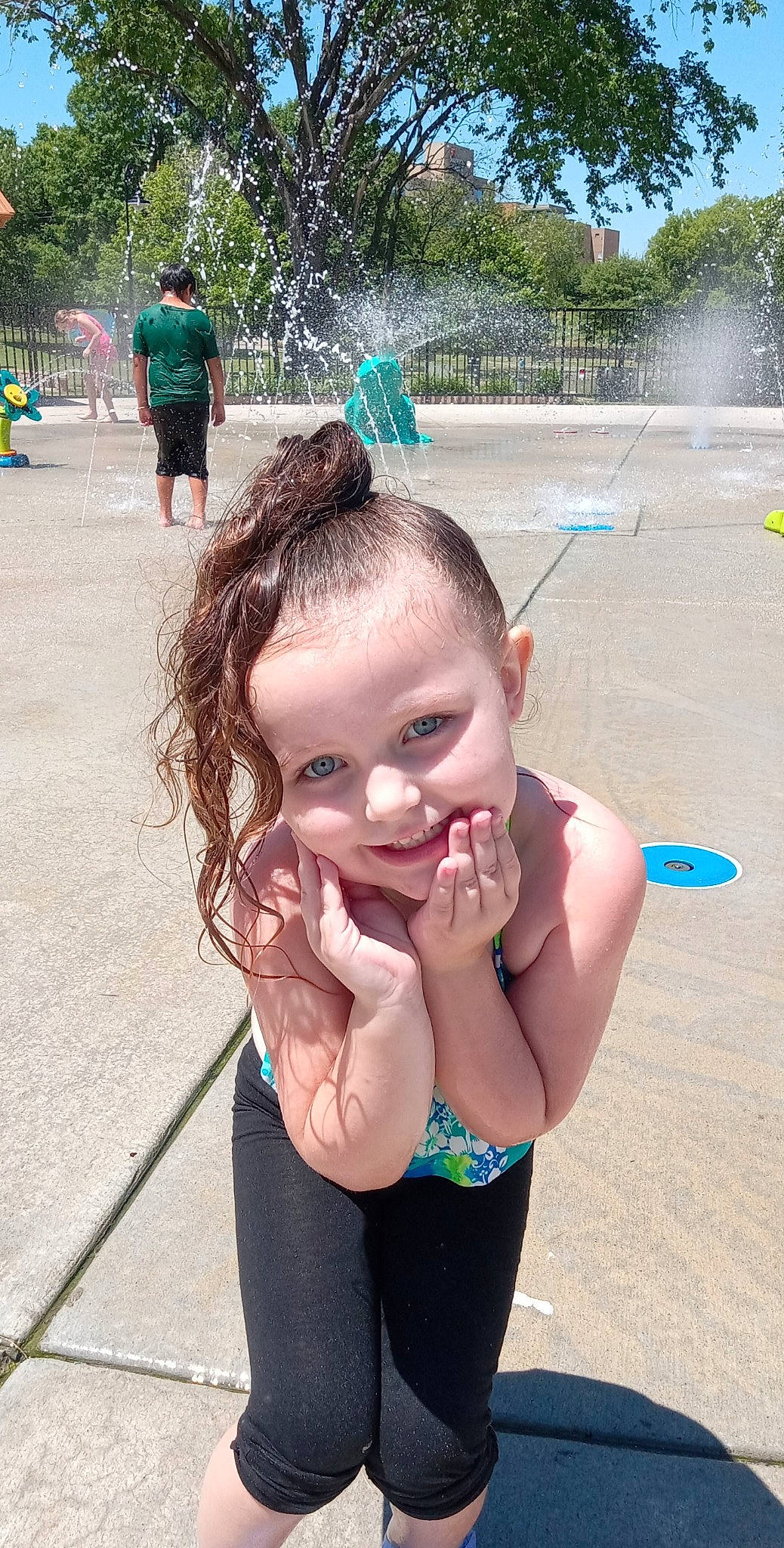 Gabriella is registered to the contest to win money with this photo: beauty, black, body_of_water, child, cool, facial_expression, fun, gesture, happy, joy, leisure, mouth, person, photograph, pink, public_space, recreation, skin, summer, toddler