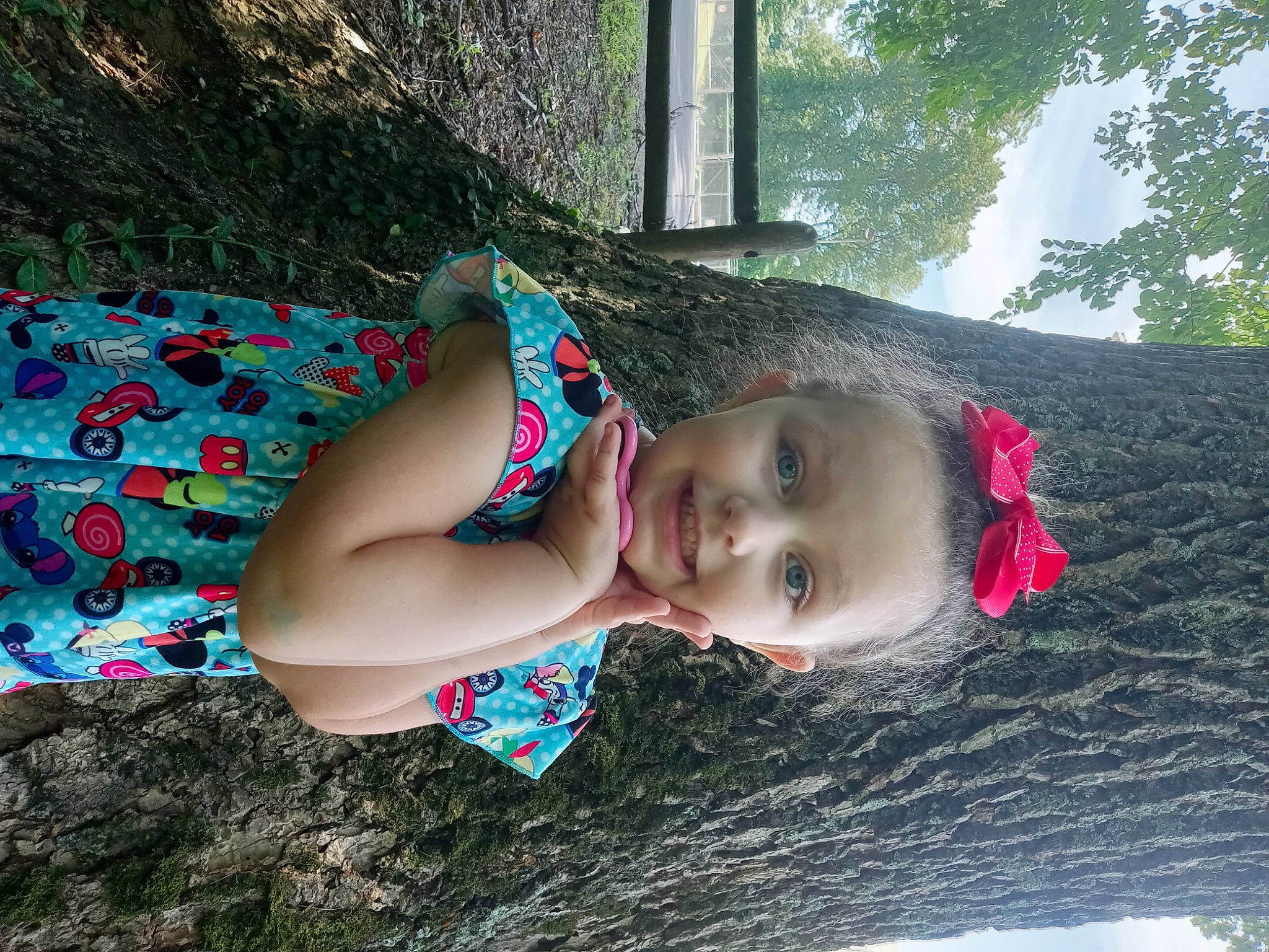 Gabriella is registered to the contest to win money with this photo: baby, child, fun, grass, happy, joy, landscape, leisure, mammal, nature, people_in_nature, person, plant, recreation, skin, smile, summer, sunlight, toddler, tree