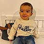 Jules participe au concours pour gagner de l'argent avec cette photo : toddler, child, smile, sweater, jeans, bench, bag, indoor, person, happy, face, cute, seated, cozy, clothing, portrait, hand, young_child, casual, background