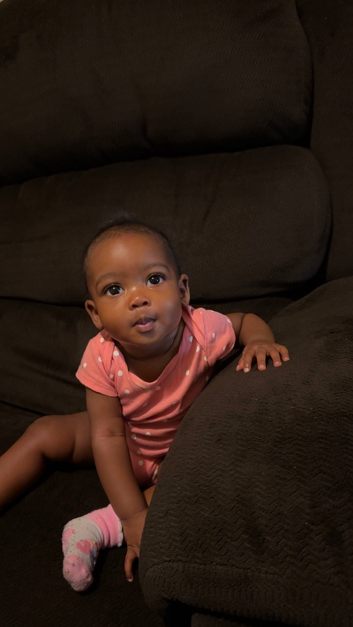 Luka is registered to the contest to win money with this photo: baby, baby_toddler_clothing, cheek, child, comfort, darkness, flash_photography, flesh, flooring, foot, fun, hardwood, human_leg, mouth, nose, person, sitting, skin, thumb, toddler