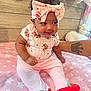 Diem joined the competition — help win amazing prizes! baby, child, pink_clothing, headband, bow, strawberry, smiling, tattoo, arm, plush_toy, blanket, star_pattern, sitting, indoors, cute, infant, wooden_wall, footwear, person, happy