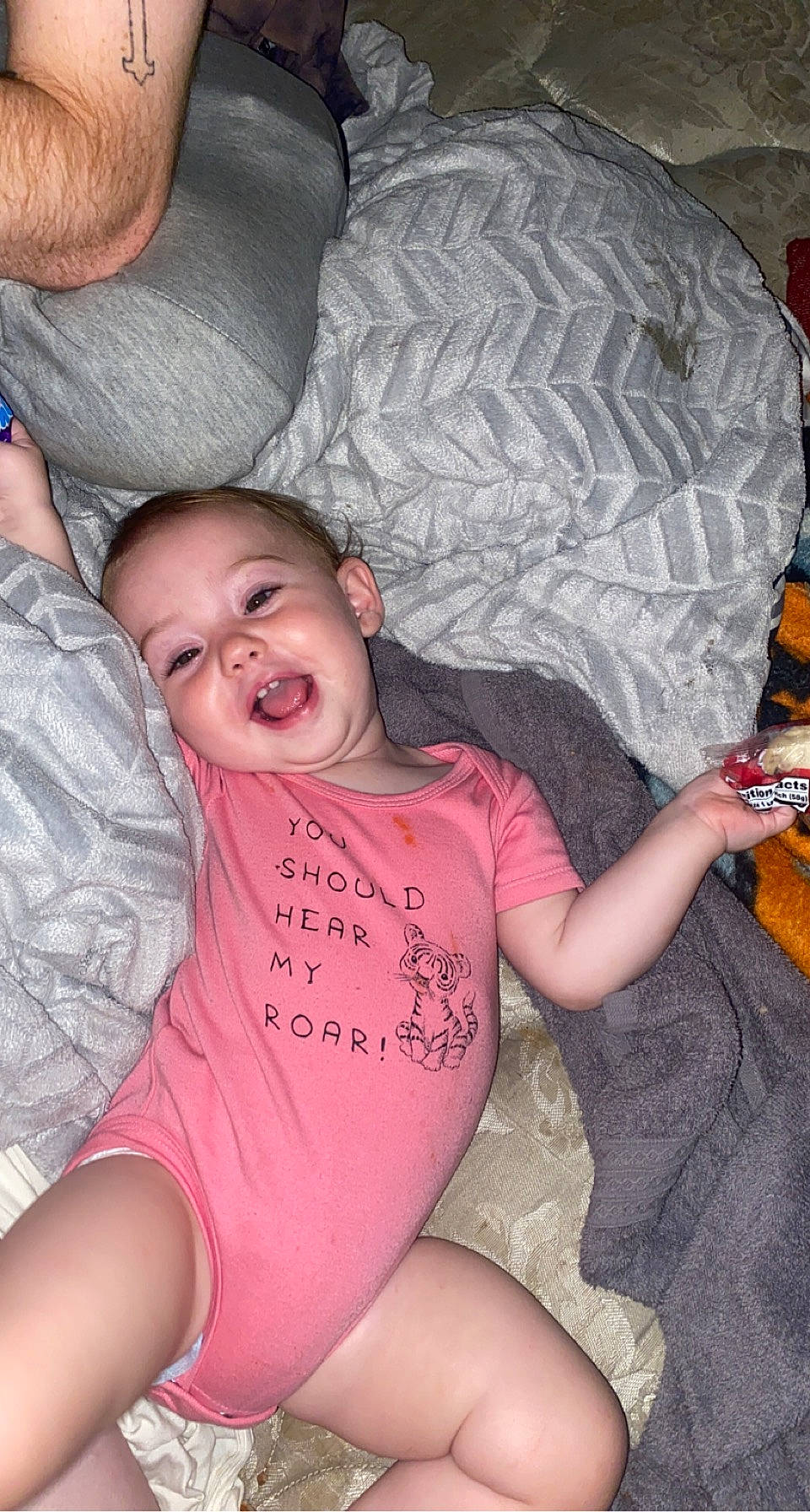 Blair is registered to the contest to win money with this photo: comfort, cool, couch, eye, finger, gesture, hair, hand, happy, head, human_body, leg, mouth, muscle, person, pink, skin, smile, textile, thigh