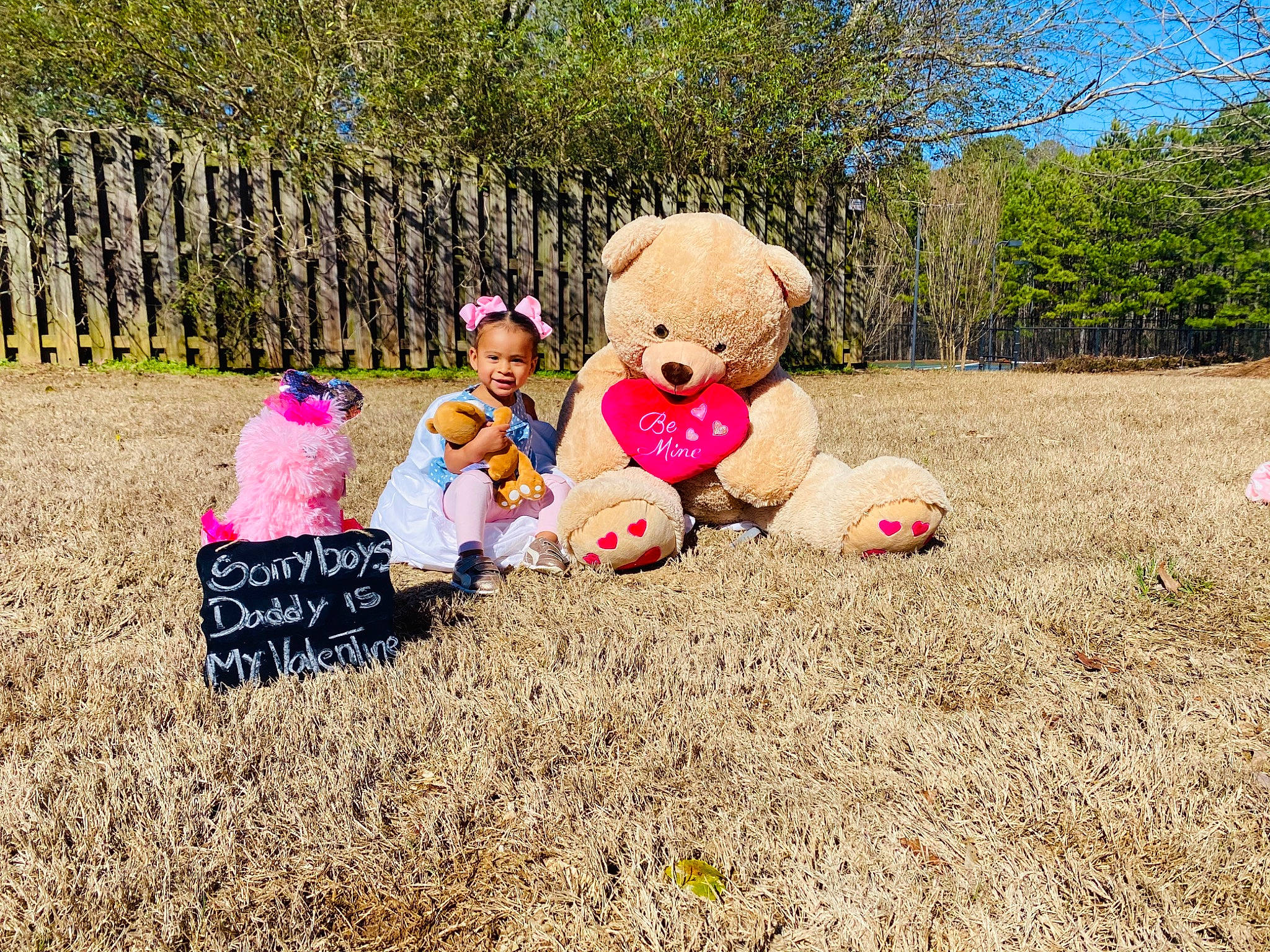 Dana is registered to the contest to win money with this photo: child, flower, fun, grass, happy, lawn, leisure, person, photography, pink, plant, play, recreation, spring, stuffed_toy, teddy_bear, toddler, toy, tree, vacation