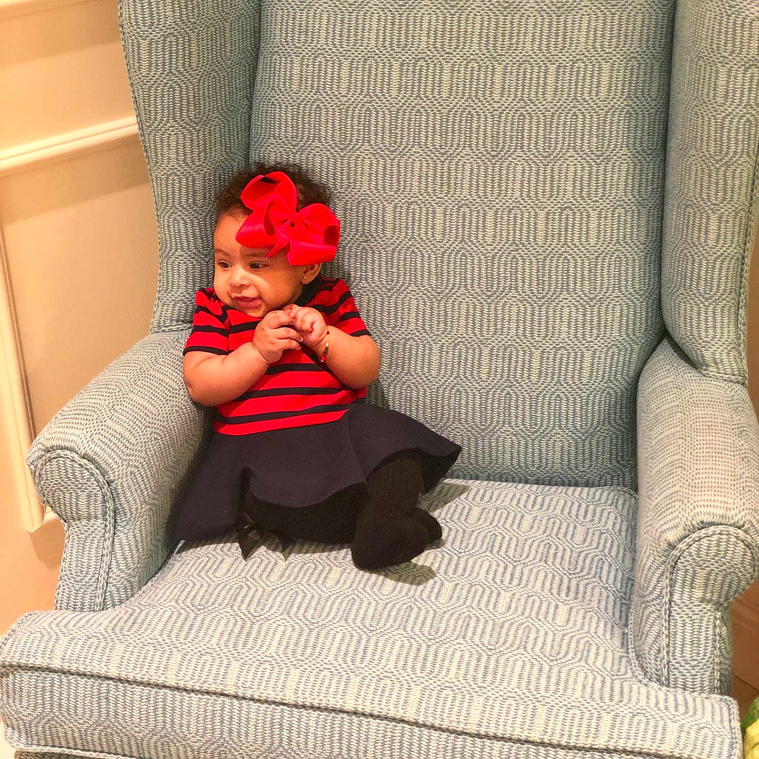 Dana is registered to the contest to win money with this photo: chair, comfort, couch, cushion, furniture, futon, interior_design, loveseat, person, red, room, sitting, slipcover, sofa_bed