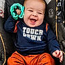 Enzo joined the competition — help win amazing prizes! baby, child, infant, smiling, laughing, portrait, car_seat, sitting, toy, green_toy, blue_shirt, orange_pants, clothing, happy, indoors, vehicle, head, face, single_person, close_up