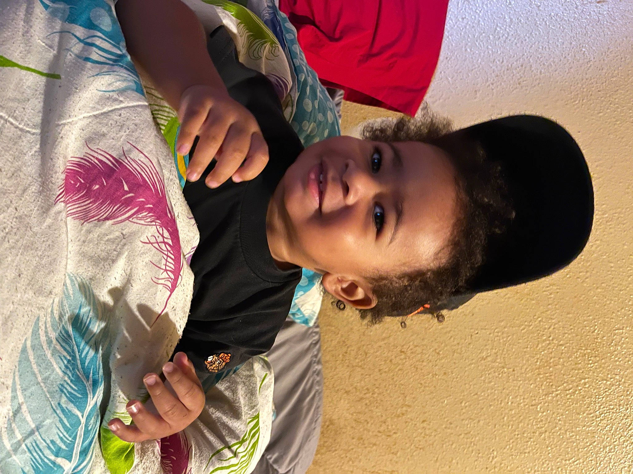 Dameon is registered to the contest to win money with this photo: black_hair, child, fashion_accessory, feather, fun, grass, hand, happy, joy, landscape, leisure, mammal, person, play, skin, sunglasses, tradition, tree, vacation