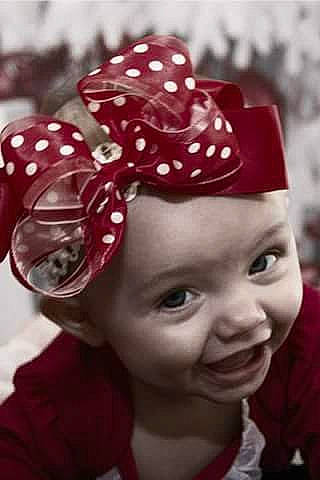 Jaycee is registered to the contest to win money with this photo: baby_toddler_clothing, cap, child, close_up, costume_hat, event, fashion_accessory, hair_accessory, happy, headgear, headpiece, headwear, joy, knit_cap, magenta, pattern, person, petal, pink, textile