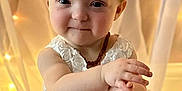 Sophia is registered to the contest to win money with this photo: accessories, baby, bodypart, clothing, costume, dress, face, finger, formalwear, hand, happy, hat, head, jewelry, person, photography, portrait, sitting, sleeve, smile