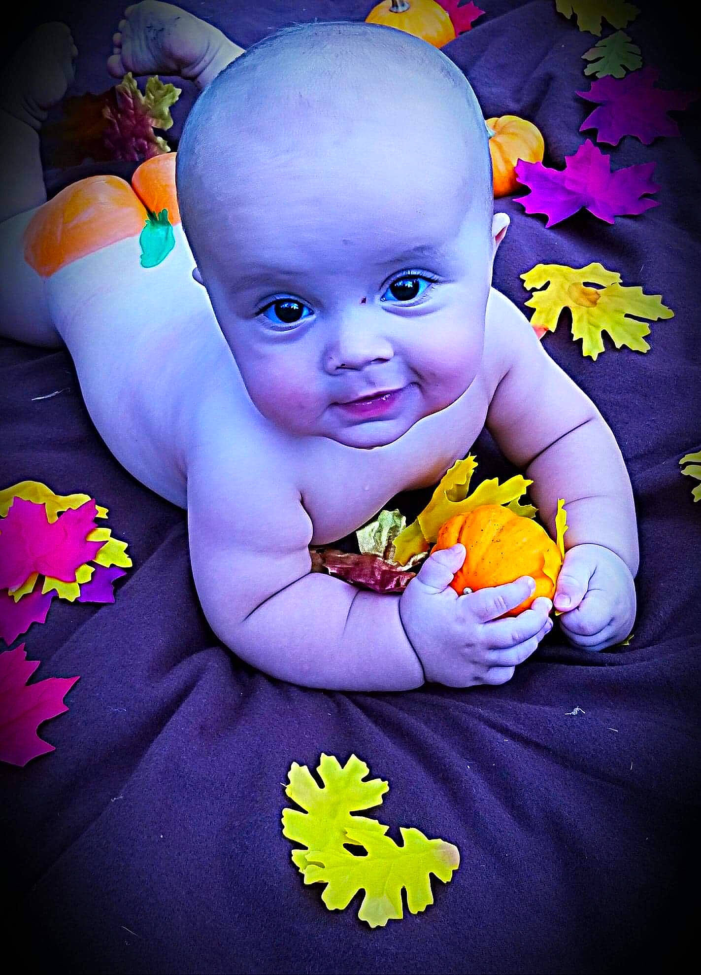 Tyson is registered to the contest to win money with this photo: baby, child, flower, person, petal, photography, plant, purple, smile, toddler