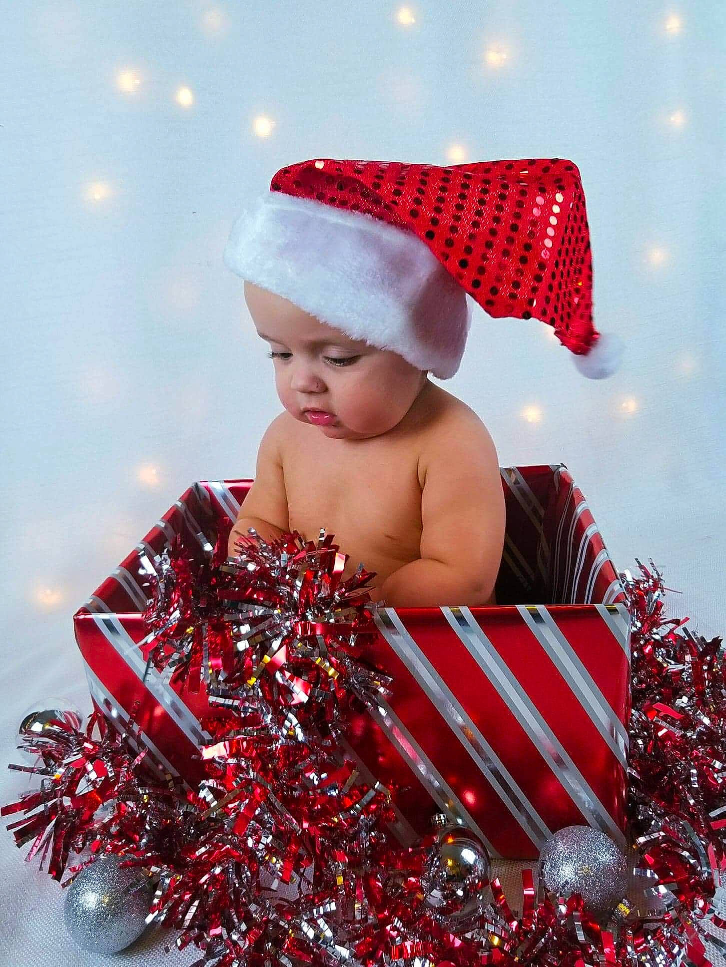 Tyson is registered to the contest to win money with this photo: baby, child, christmas, christmas_eve, christmas_ornament, happy, holiday, person, red, toddler