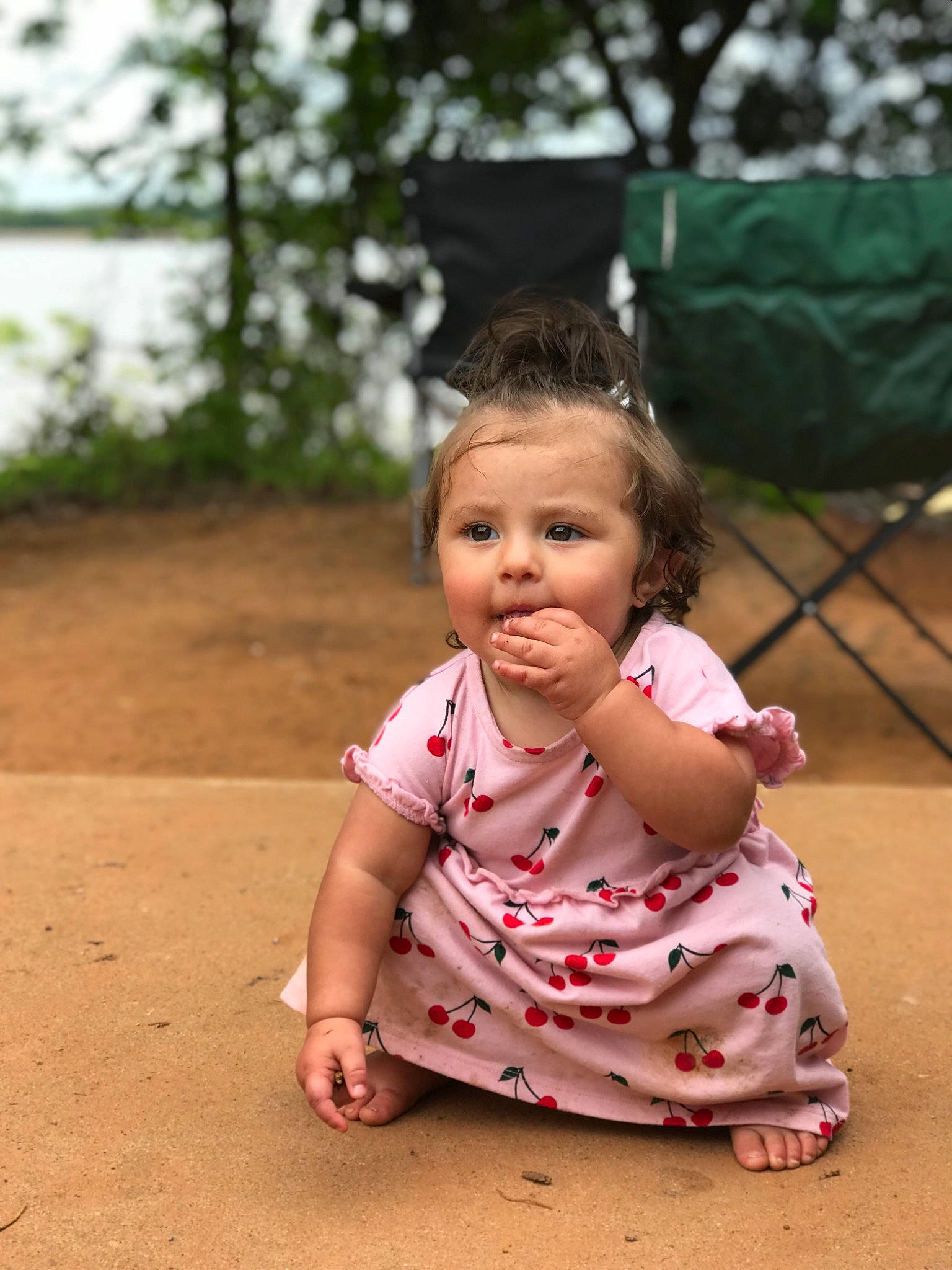 Lizzy is registered to the contest to win money with this photo: baby, cheek, child, chin, eye, face, fun, grass, head, lip, people, person, photography, pink, plant, sitting, skin, smile, summer, toddler