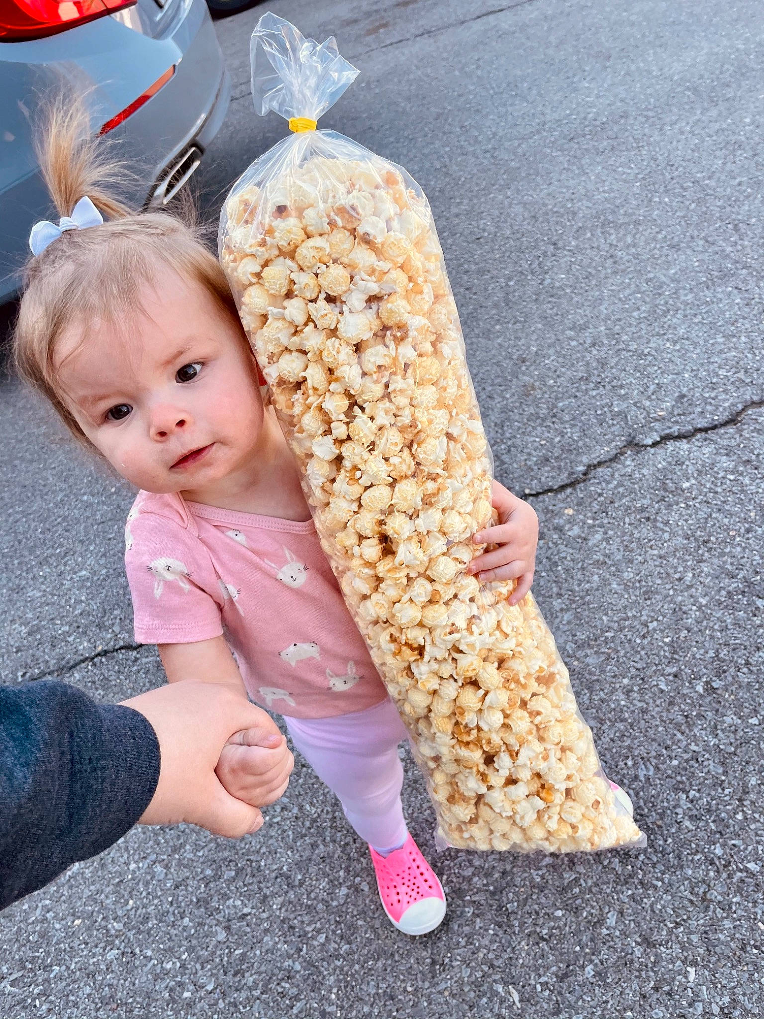 Johanna joined the competition — help win amazing prizes! baby, baby_toddler_clothing, barefoot, blond, fashion_accessory, finger, food, foot, gesture, grass, happy, human_leg, pattern, person, sitting, sleeve, sock, tableware, thumb, toddler