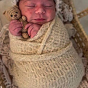 Amira joined the competition — help win amazing prizes! newborn, baby, swaddled, blanket, teddy_bear, basket, sleeping, lace, knit, cute, infant, cozy, portrait, resting, peaceful, soft_texture, handmade, wrapped, child, adorable