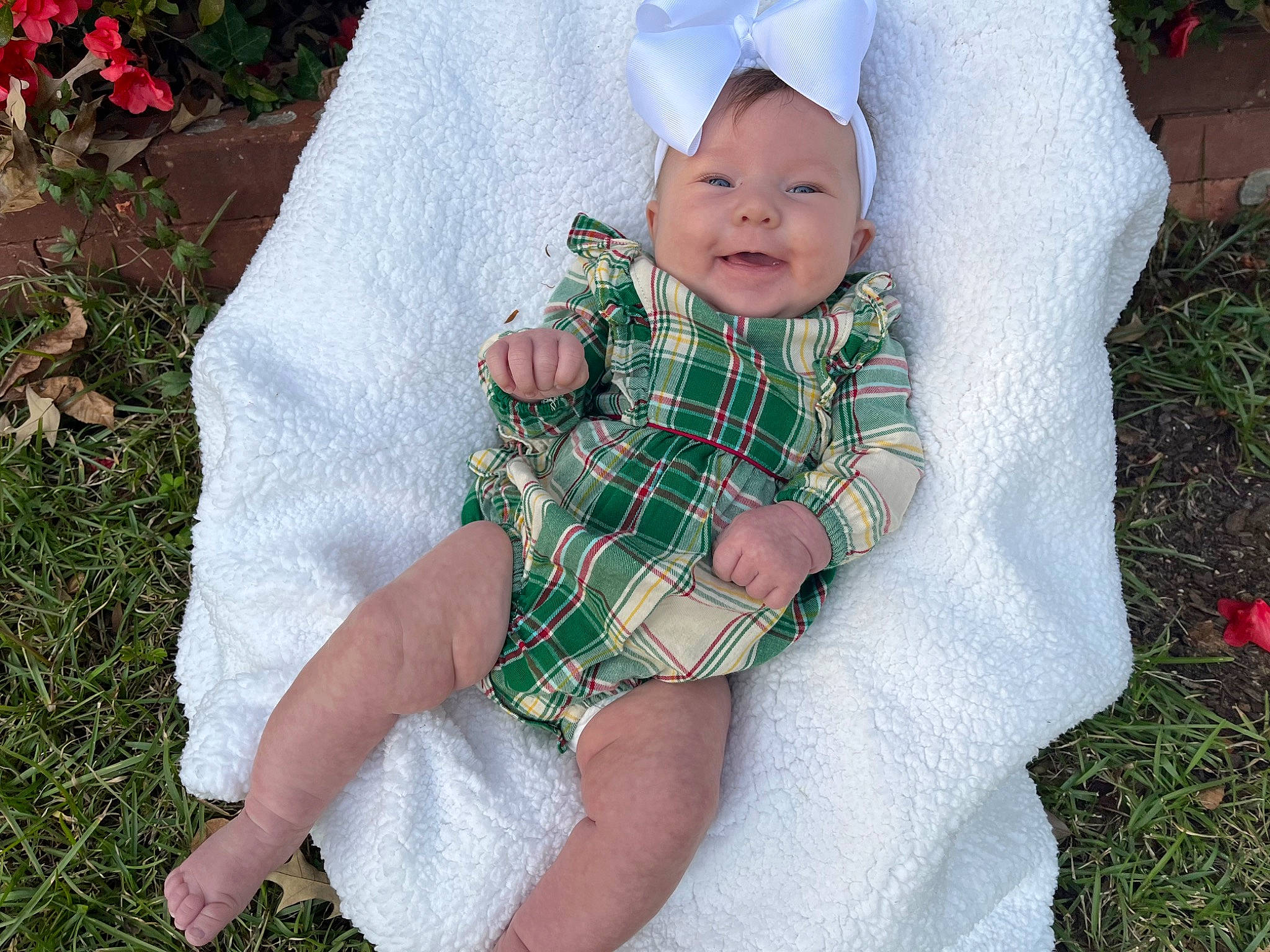 Landry joined the competition — help win amazing prizes! baby, baby_toddler_clothing, child, grass, happy, head, headwear, human_body, leaf, leg, pattern, people_in_nature, person, pink, plaid, plant, skin, sleeve, smile, tartan