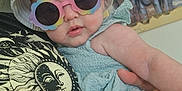 Maylie participe au concours pour gagner de l'argent avec cette photo : art, baby, blue_clothing, bucket_hat, child, cute, elephants, face, fashion, hand, hat, holding, indoor, painting, person, portrait, sunglasses, toddler, wall, wearing