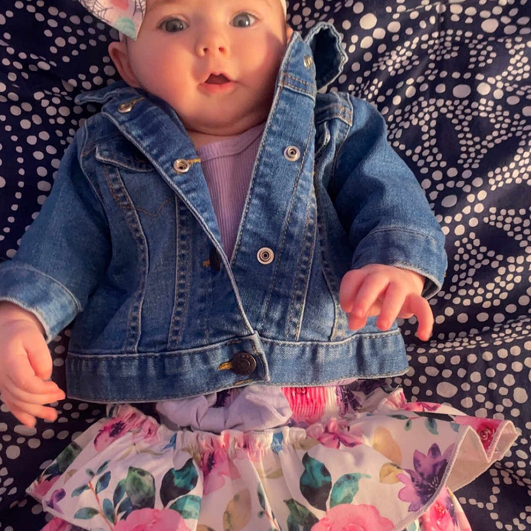 Giavanna is registered to the contest to win money with this photo: baby, clothing, coat, costume, dress, face, flower, hat, head, jacket, jeans, miniskirt, pants, person, petal, photography, plant, portrait, shorts, skirt