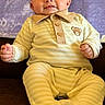 Colsen joined the competition — help win amazing prizes! baby, infant, child, smile, yellow_pajamas, striped_clothing, teddy_bear_emblem, couch, seated, portrait, indoor, face, head, hands, feet, cozy, comfortable, background, purple_background, happy
