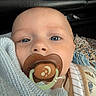 Colsen is registered to the contest to win money with this photo: baby, blanket, blue_eyes, child, close_up, clothing, cute, eyelashes, face, human, indoors, infant, mouth, newborn, nose, pacifier, portrait, skin, soft_texture, warm