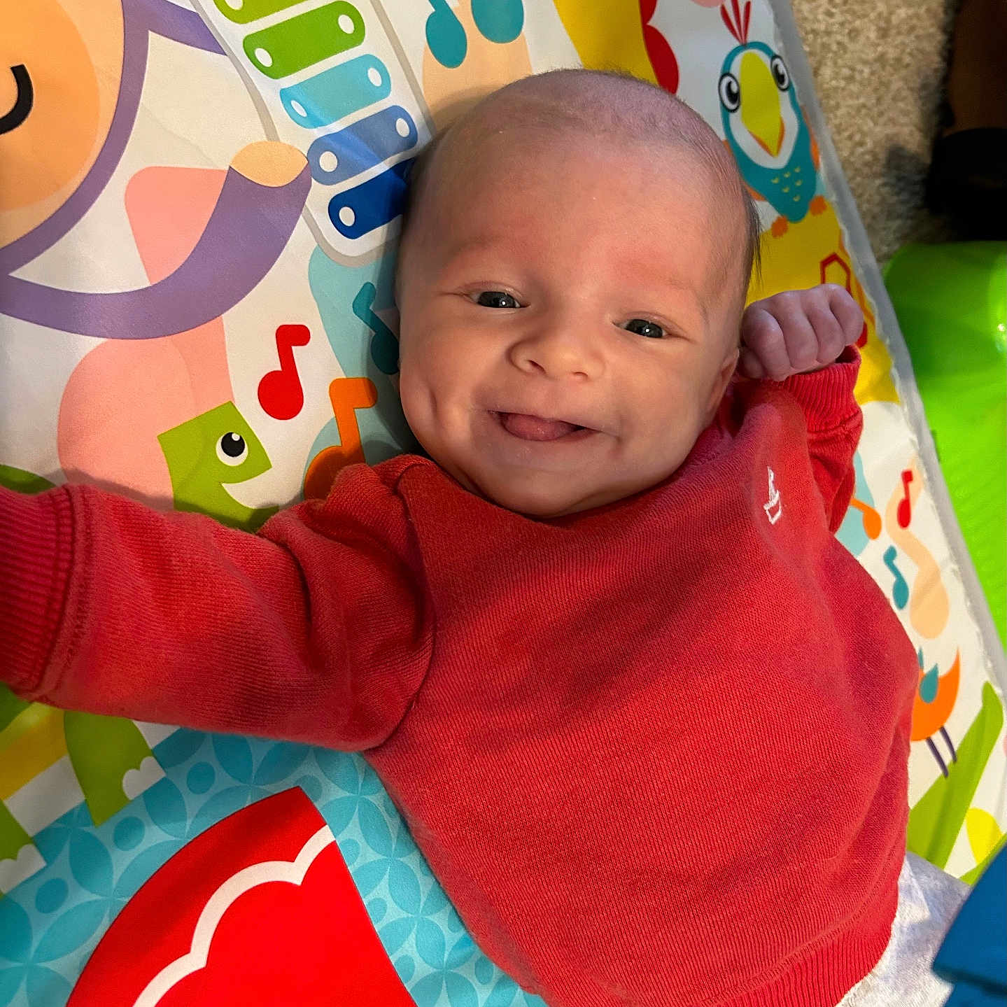 Oakley is registered to the contest to win money with this photo: baby, bed, blanket, bodypart, clothing, crib, cushion, face, furniture, happy, head, homedecor, infantbed, newborn, person, photography, portrait, quilt, smile, t_shirt