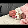 Talene joined the competition — help win amazing prizes! newborn, baby, sleeping, blanket, pink_blanket, white_outfit, bear_design, couch, gray_couch, cozy, soft_texture, peaceful, infant, person, resting, indoors, cute, portrait, closeup, relaxation