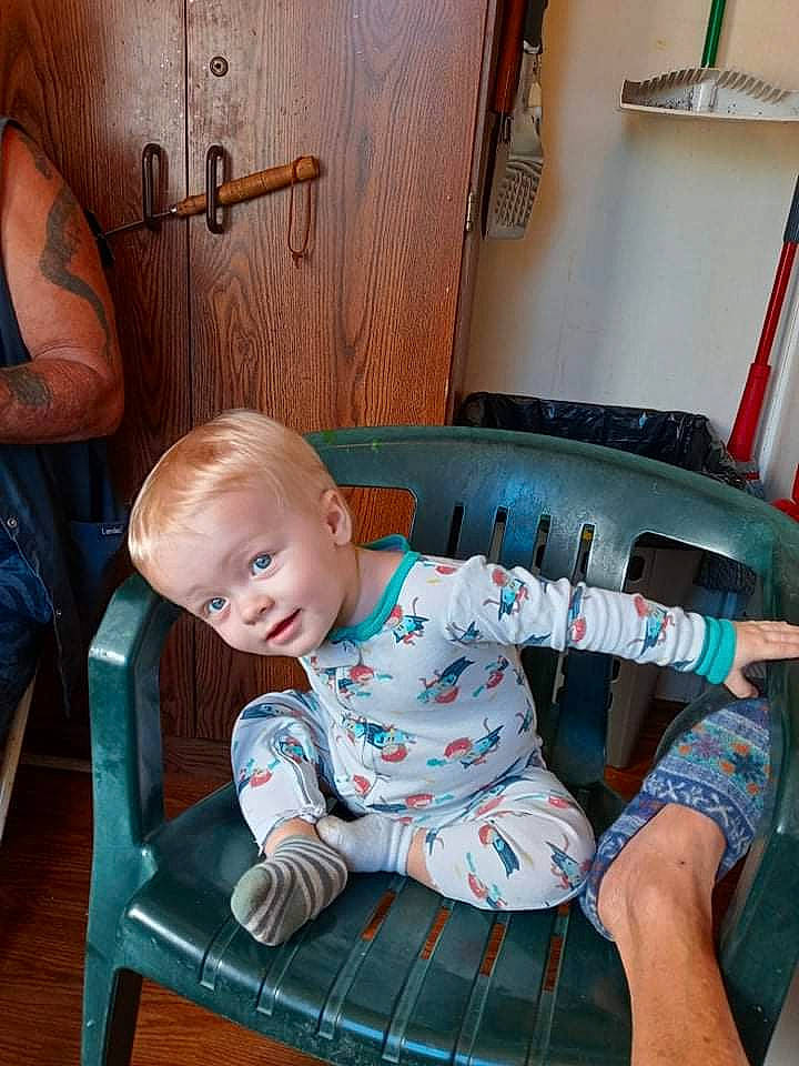 Chandler joined the competition — help win amazing prizes! baby, baby_toddler_clothing, chair, comfort, flooring, hairstyle, hardwood, joint, knee, lap, leg, person, plaid, product, sitting, sleeve, standing, tartan, thigh, toddler