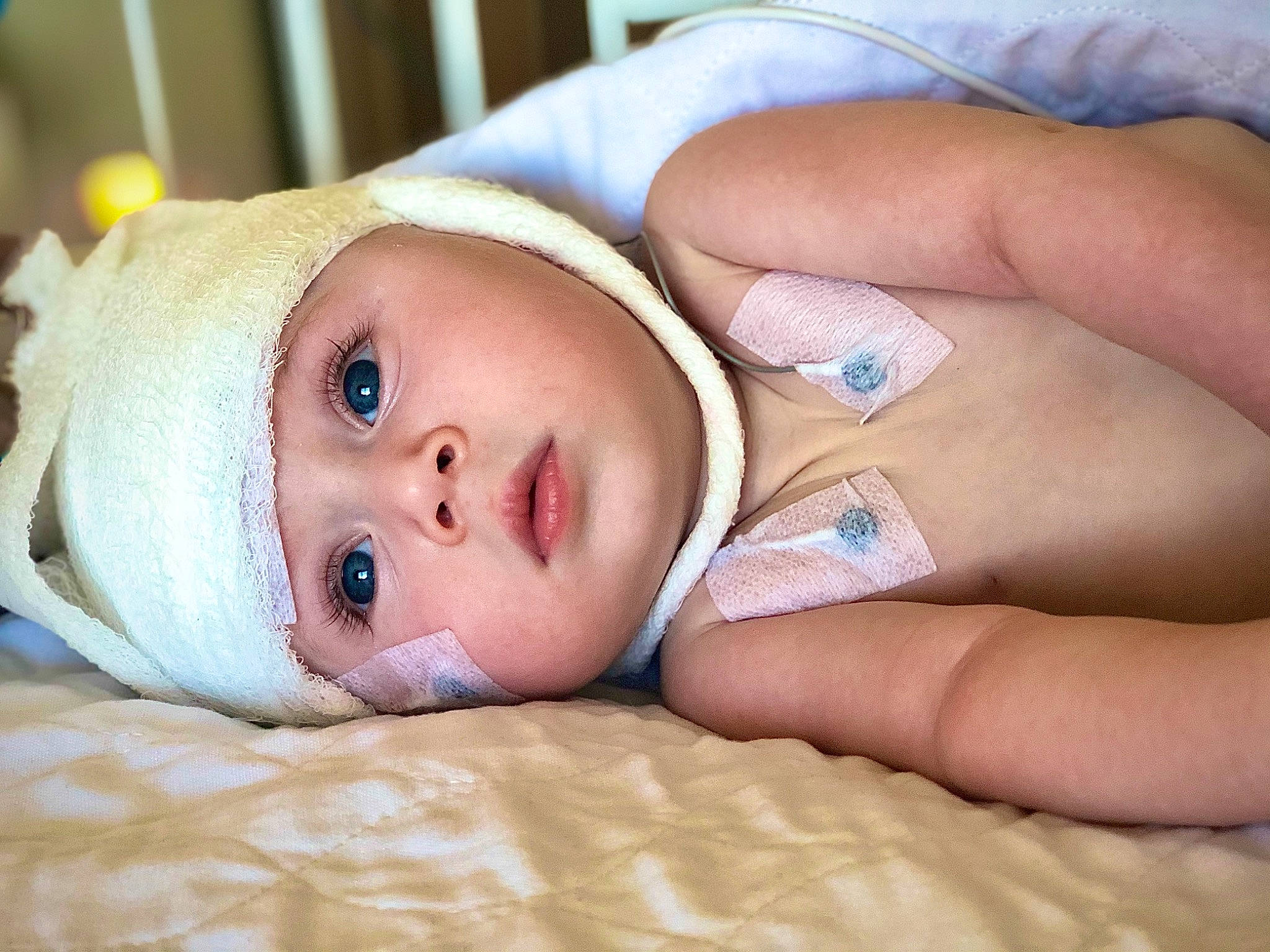 Mckinlee is registered to the contest to win money with this photo: baby, baby_toddler_clothing, cheek, child, comfort, eye, eyebrow, eyelash, face, finger, head, headgear, headwear, human_body, iris, lip, mouth, nose, person, skin
