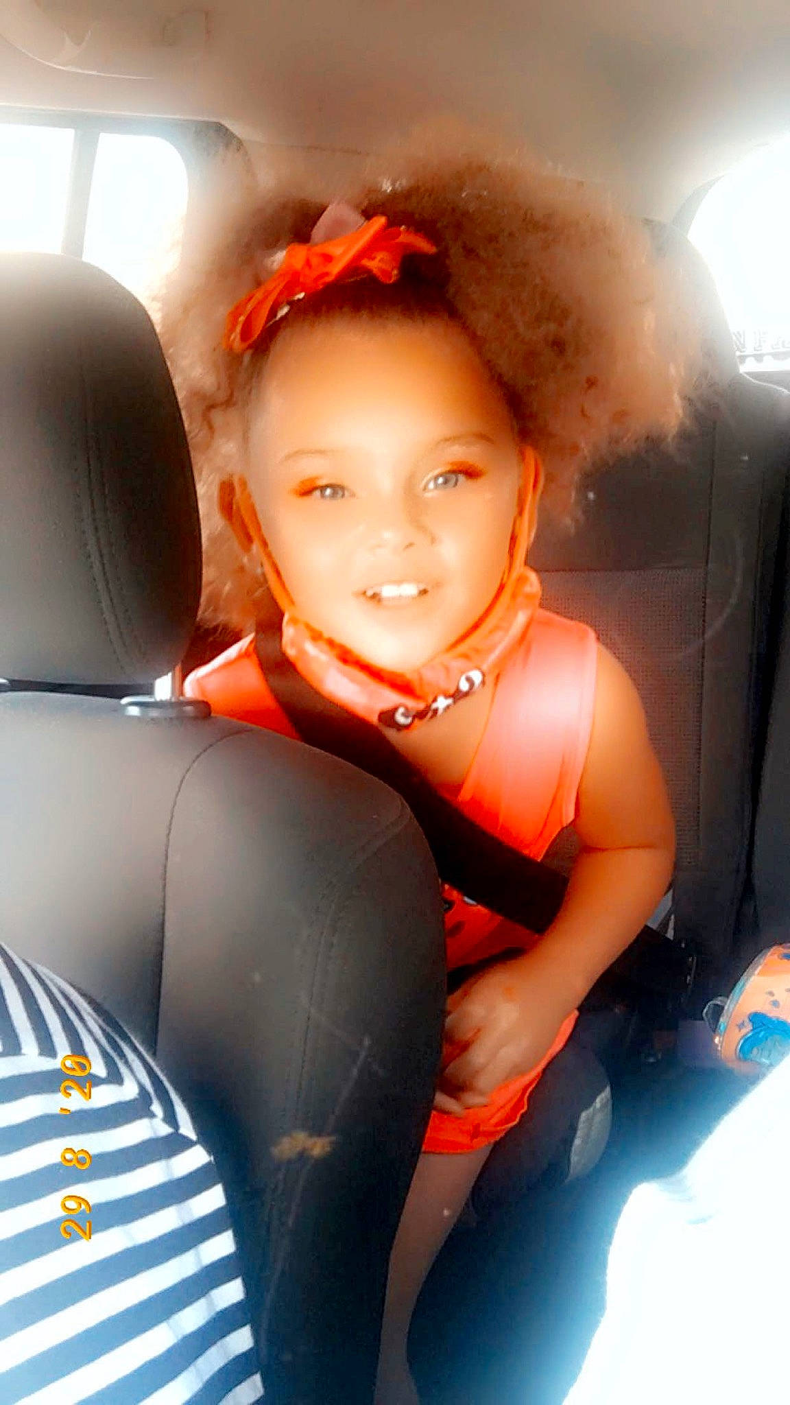 Dreauna is registered to the contest to win money with this photo: car_seat, family_car, joy, person, smile