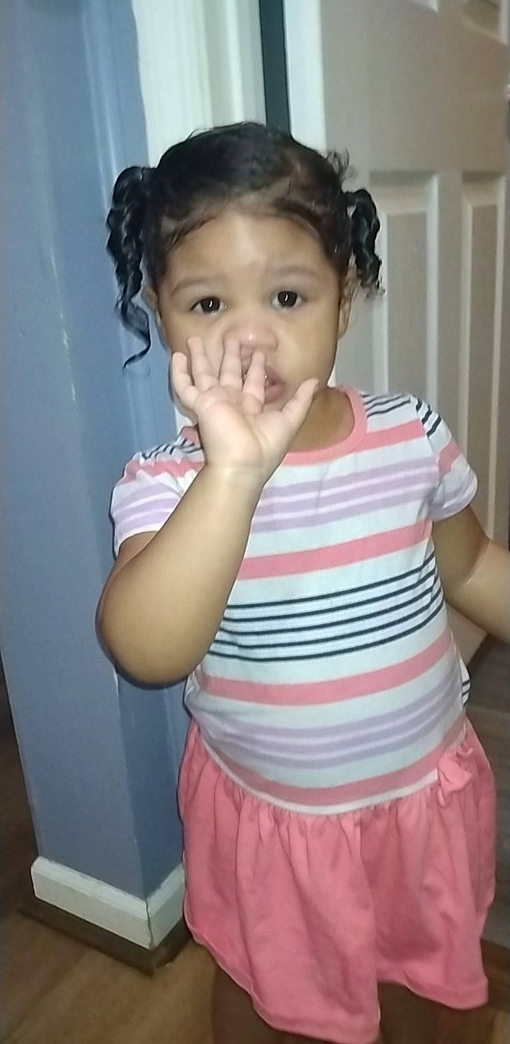 Scarrlett is registered to the contest to win money with this photo: arm, baby_toddler_clothing, cheek, chin, ear, eye, eyelash, facial_expression, gesture, hair, head, iris, joint, neck, nose, organ, person, shoulder, skin, sleeve