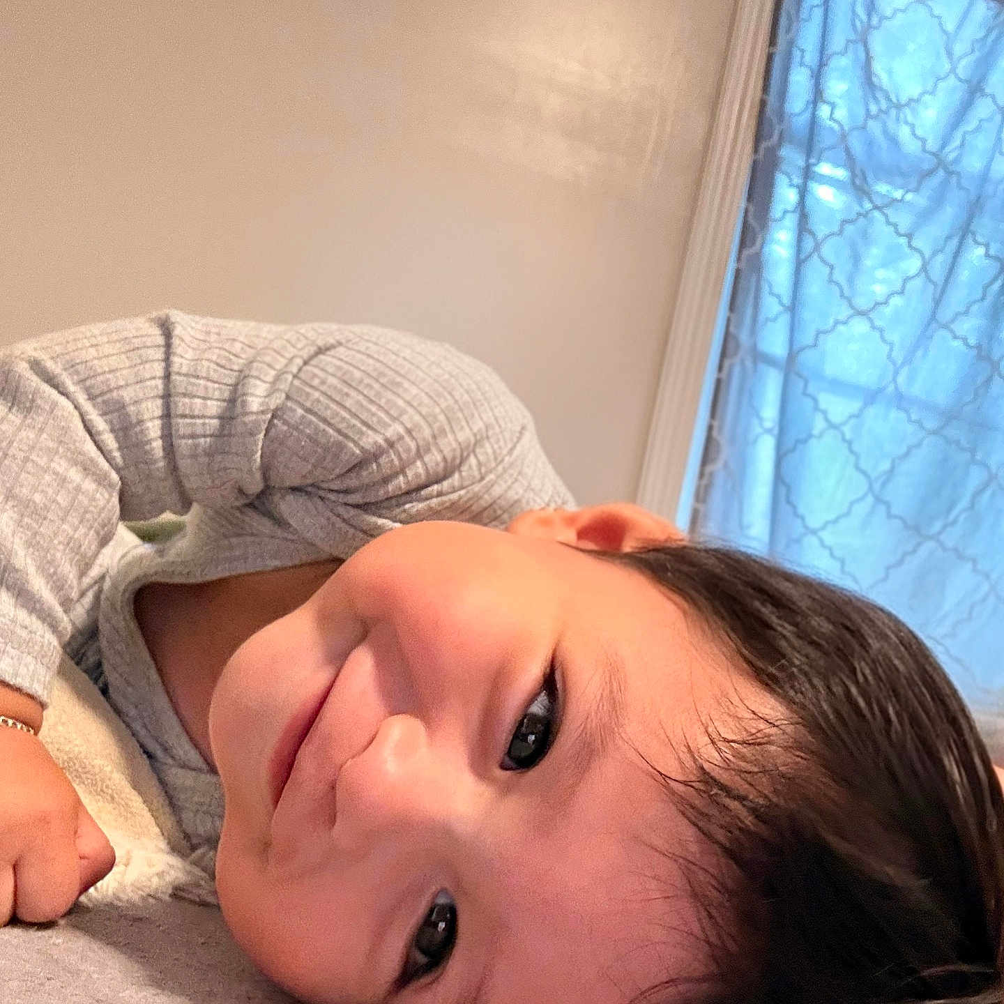 Angel Cruz joined the competition — help win amazing prizes! boy, child, cozy, curtain, cute, expression, fabric, face, hair, happy, home, indoor, laying_down, long_sleeve, person, portrait, skin, smiling, soft_light, window