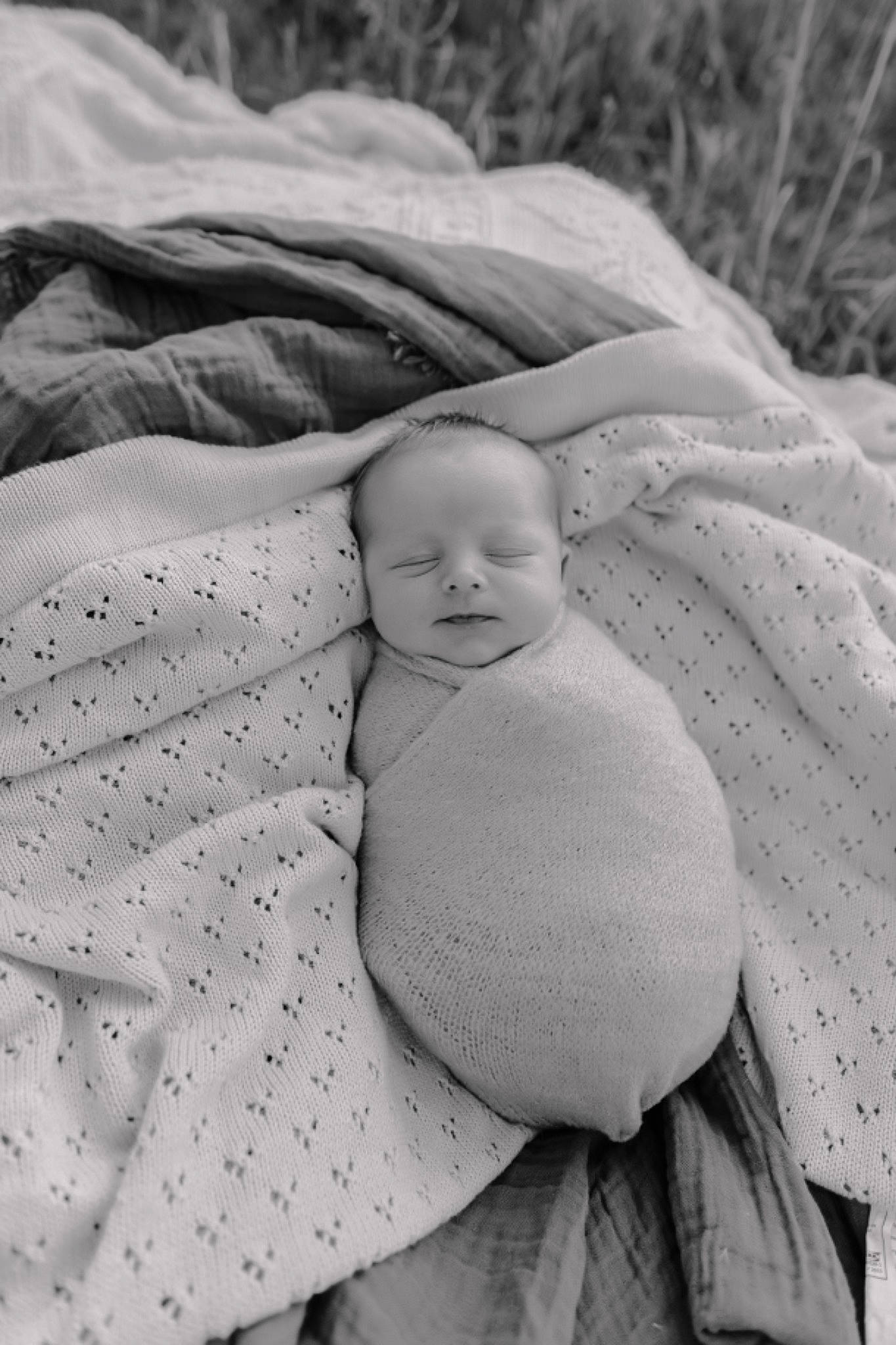 Maddex is registered to the contest to win money with this photo: baby, baby_products, baby_toddler_clothing, child, comfort, eye, face, grass, happy, linens, monochrome, monochrome_photography, pattern, people_in_nature, person, portrait_photography, sleep, textile, thumb, toddler