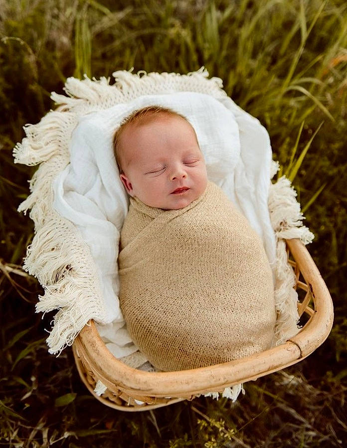 Maddex is registered to the contest to win money with this photo: art, baby, baby_toddler_clothing, clothing, eye, fashion_accessory, fur, grass, grass_family, happy, hat, headgear, outerwear, people_in_nature, person, plant, sitting, toddler, tree, wood