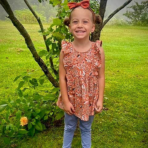 Alexis joined the competition — help win amazing prizes! baby_toddler_clothing, child, fashion_accessory, grass, grassland, happy, head, joy, leaf, magenta, meadow, pattern, people_in_nature, person, plant, sleeve, smile, spring, t_shirt, toddler