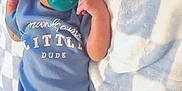 Karter is registered to the contest to win money with this photo: baby, infant, pacifier, blue_onesie, blanket, checkered_pattern, wooden_sign, one_month, lying_down, cute, newborn, handsome, little_dude, child, soft_texture, indoors, portrait, skin, face, sleepwear