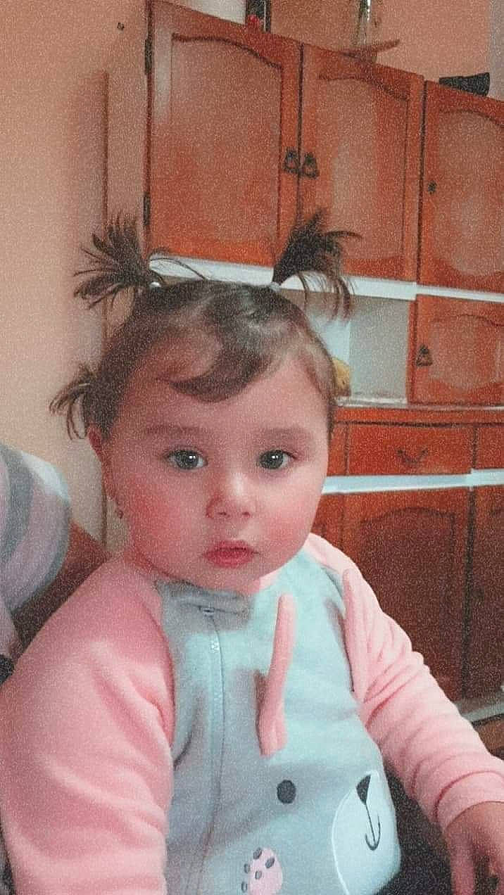 Lea is registered to the contest to win money with this photo: baby, baby_toddler_clothing, cabinetry, cheek, child, child_model, eye, eyebrow, eyelash, forehead, hair_accessory, hairstyle, mouth, person, pink, toddler