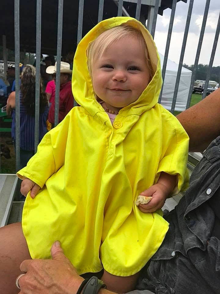 Maybree is registered to the contest to win money with this photo: child, costume, fun, jacket, joy, outerwear, person, raincoat, toddler, vacation, yellow