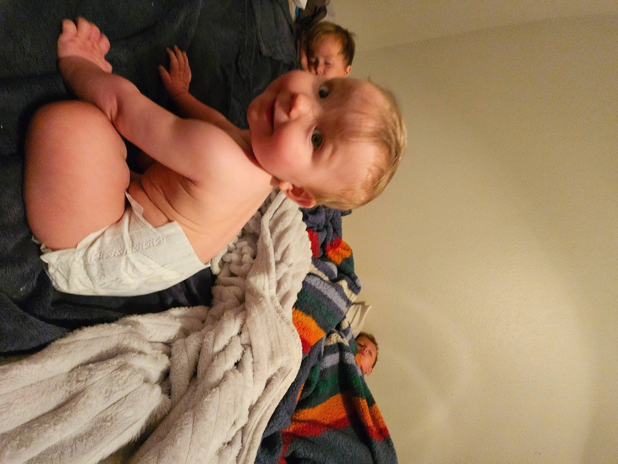 Leanna is registered to the contest to win money with this photo: abdomen, baby, ceremony, child, comfort, elbow, event, flash_photography, fun, fur, gesture, happy, jewellery, person, room, sitting, smile, toddler, tradition, tree