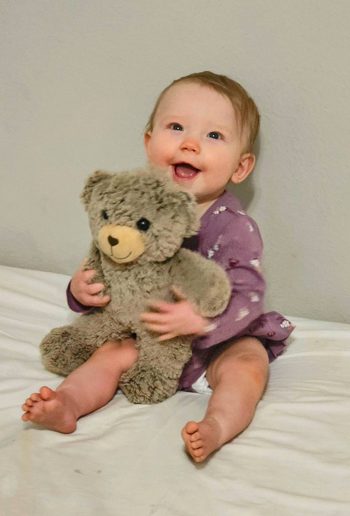 Leanna joined the competition — help win amazing prizes! arm, baby, baby_toddler_clothing, cheek, child, comfort, fawn, finger, gesture, happy, head, human_body, person, pink, sitting, skin, sleeve, smile, teddy_bear, toddler