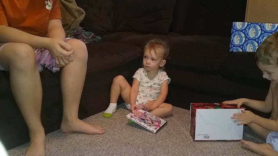 Annabelle is registered to the contest to win money with this photo: arm, child, finger, fun, girl, hand, leg, person, play, product, reading, sitting, toddler