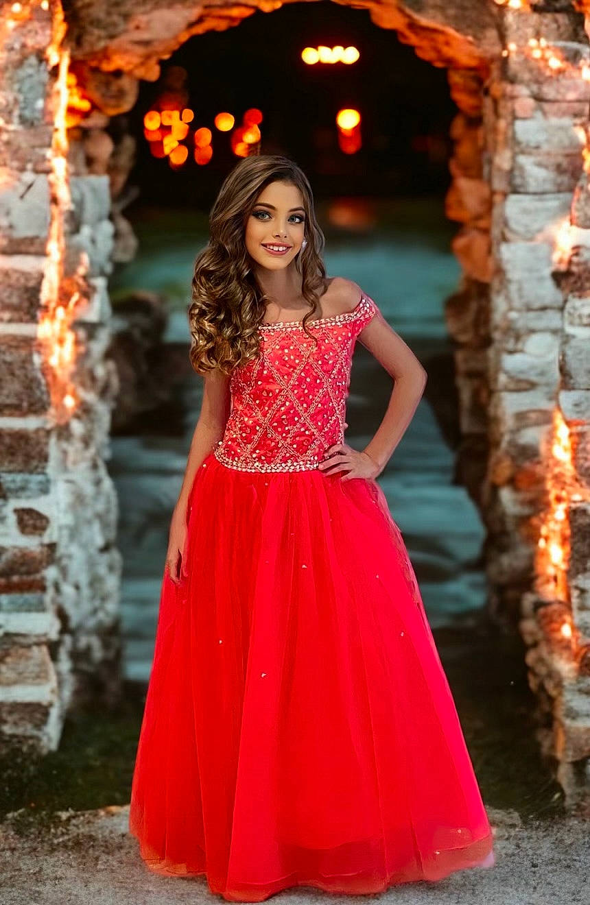 Sophia is registered to the contest to win money with this photo: abdomen, arm, black_hair, day_dress, fashion_design, fashion_model, flash_photography, formal_wear, gown, happy, human_body, joy, neck, one_piece_garment, orange, people_in_nature, person, sleeve, smile, temple