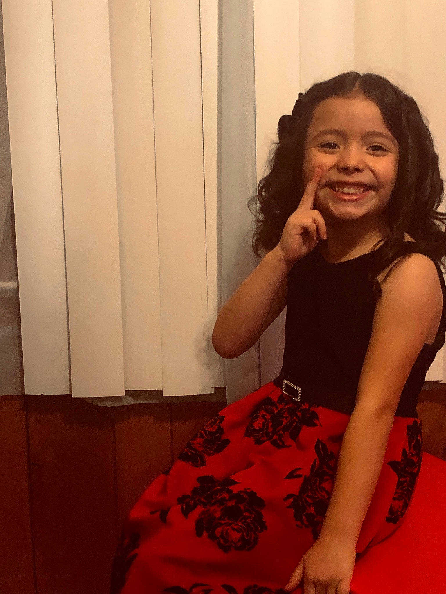 Aurora Rose Duenaz joined the competition — help win amazing prizes! black_hair, brown_hair, dress, joy, lady, leg, long_hair, person, red, shoulder, sitting, smile, thigh