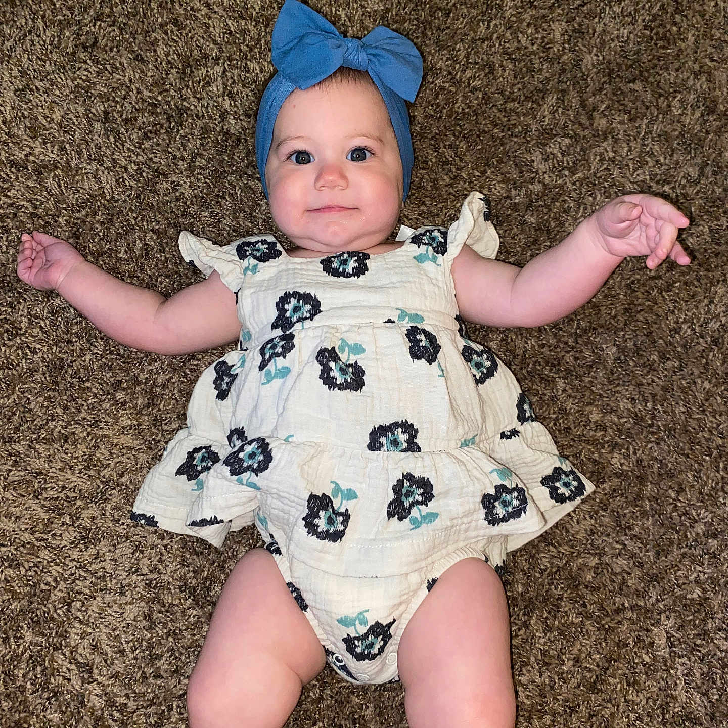 Everleigh is registered to the contest to win money with this photo: baby, bonnet, cap, clothing, costume, diaper, dress, face, hat, head, homedecor, newborn, pants, person, photography, portrait, quilt, shorts, sitting, swimwear