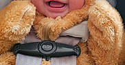 Olivia is registered to the contest to win money with this photo: baby, buckle, car_seat, cheeks, child, closeup, cozy, cute, face, fuzzy, happy, hood, infant, onesie, plush, portrait, safety_harness, seatbelt, smile, transportation