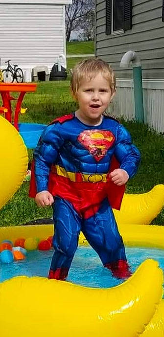 Nathaniel is registered to the contest to win money with this photo: avengers, chair, child, clothing, electric_blue, fictional_character, fun, justice_league, leisure, nonbuilding_structure, person, photograph, plant, play, recreation, smile, spider_man, superman, t_shirt, toddler