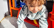 Marcello joined the competition — help win amazing prizes! active, adventure, casual_clothing, child, climbing, colorful, curly_hair, daylight, exploring, fun, happy, nature, outdoor, person, play_equipment, playground, shadow, sunlight, toddler, young