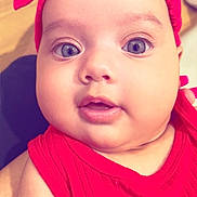 Leearnah joined the competition — help win amazing prizes! apparel, baby, baby_girl, blue_eyes, child, chubby_cheeks, close_up, cute, expression, face, hand, headband, headwear, indoors, infant, person, portrait, red_clothing, skin, young_child