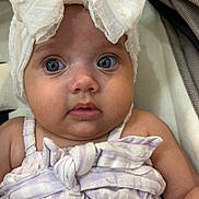 Leearnah is registered to the contest to win money with this photo: adorable, baby, blue_eyes, bow, child, closeup, clothing, cute, expression, face, headband, infant, innocent, person, portrait, sitting, skin, soft, striped, young