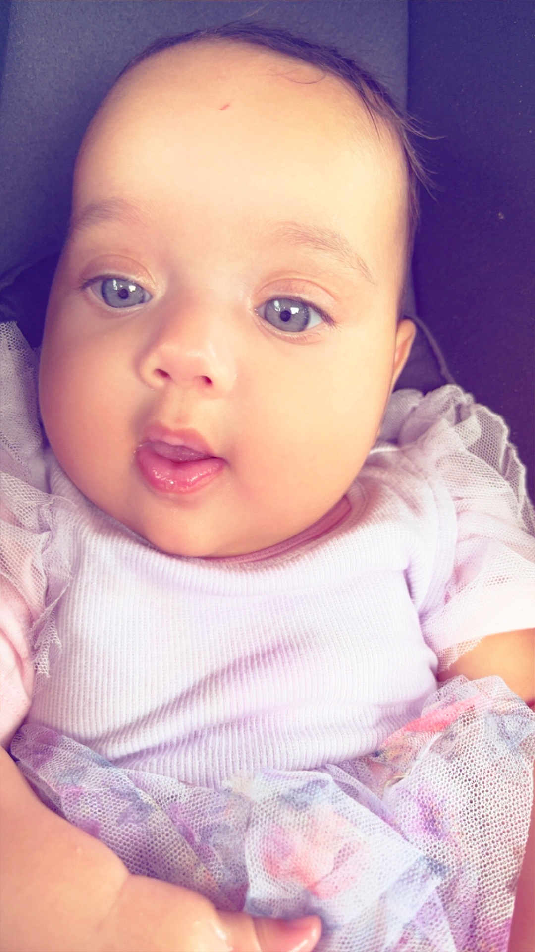 Leearnah joined the competition — help win amazing prizes! baby, infant, face, blue_eyes, clothing, purple_outfit, tulle, cute, closeup, child, portrait, skin, hand, young, adorable, expression, soft_light, indoors, person, newborn